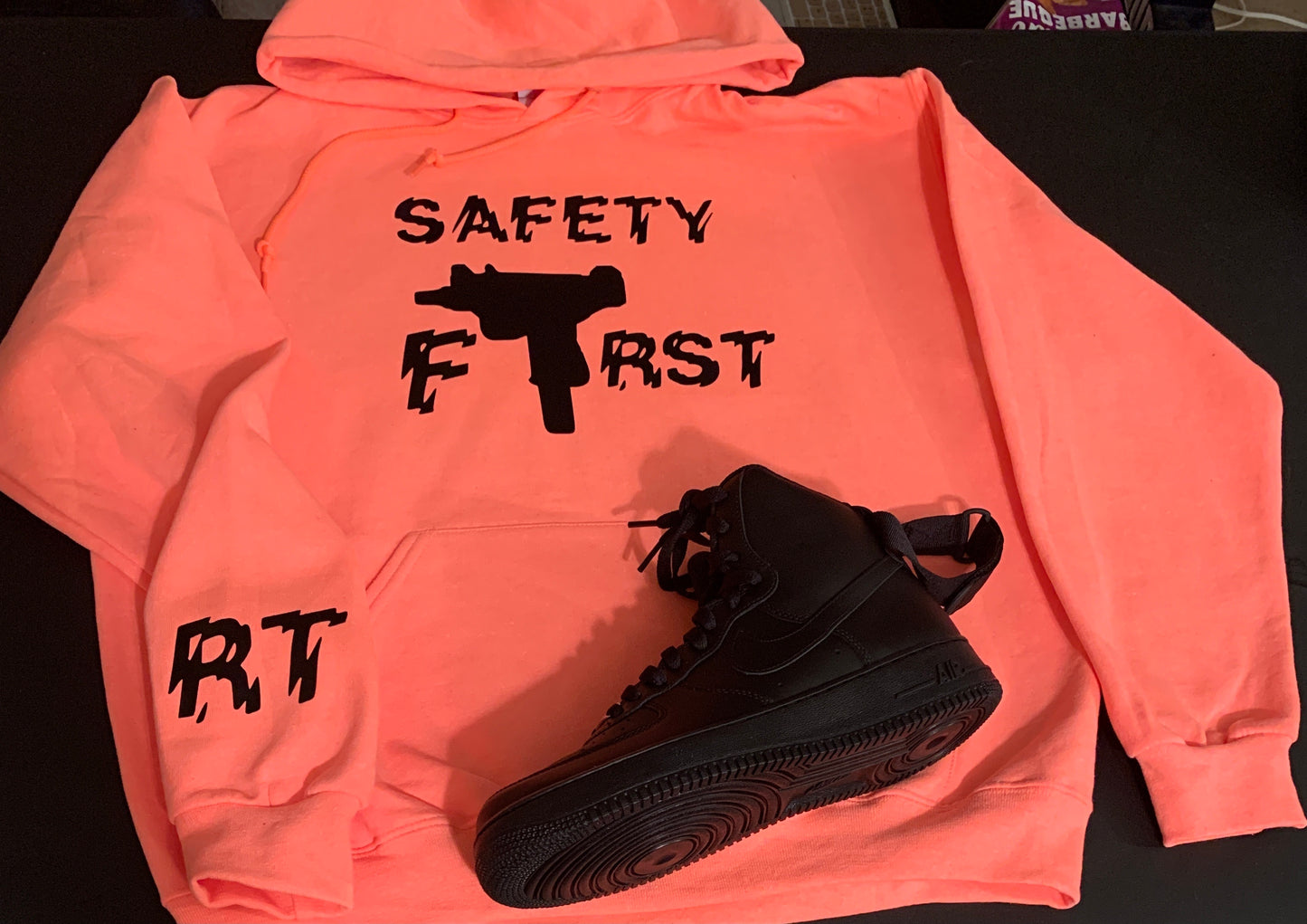 Peach With Black Safety First Logo